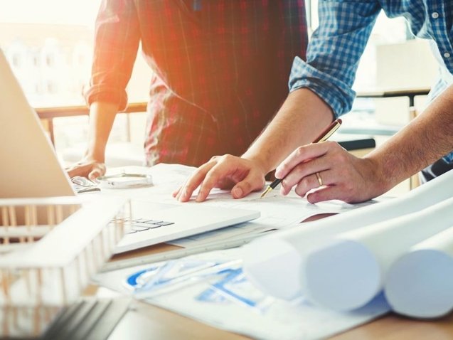 Engineer meeting for architectural project and working with partner engineering on workplace